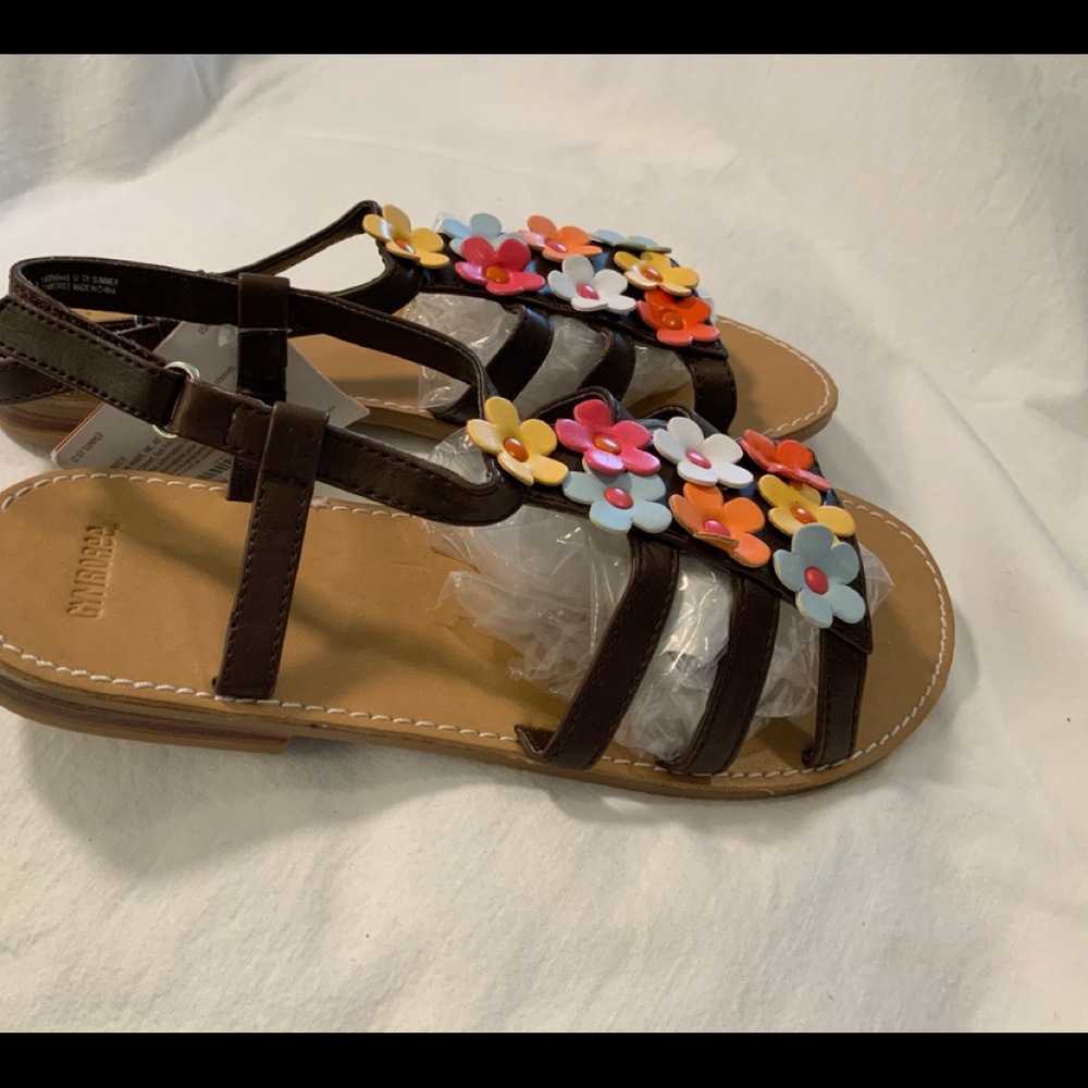 Brown kids leather sandals with colorful flowers.